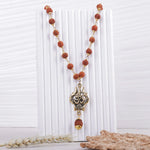 OM Shiva Trishool Rudraksha necklace on white display stand, 54 beads