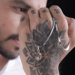 Indonesian Rudraksha pendant with silver lotus cap worn by man