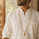 Man wearing original Tulsi japa mala with 108 beads and saffron tassel