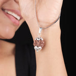 Woman wearing original Nepali Rudraksha pendant necklace with silver cap detailing