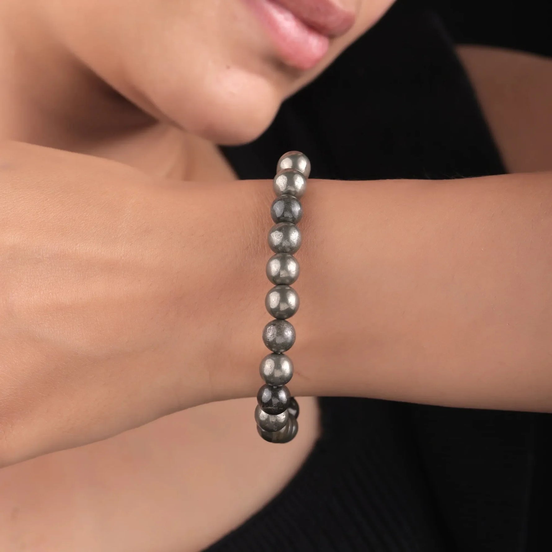 Unisex Pyrite stone bead bracelet worn by model